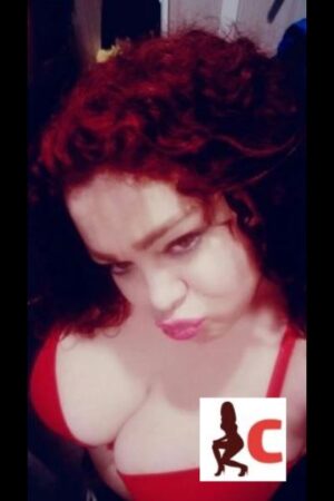 pouty lipped busty Longford escort with curly hair