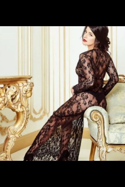 classy Wigan escort in black see through dress