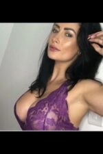 busty beautiful Belfast escort in purple lace