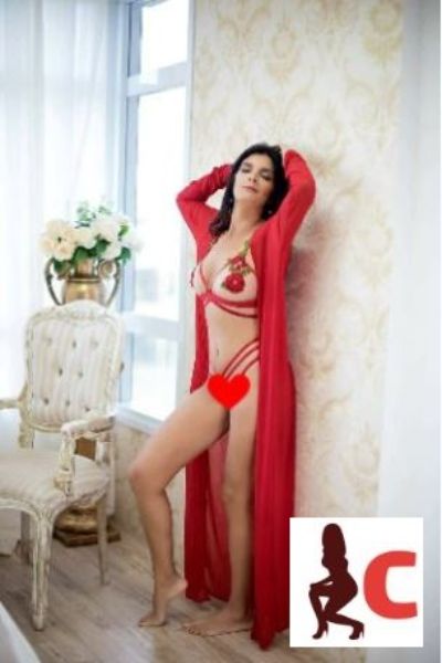 erotic Aberdeen escort in a red gown