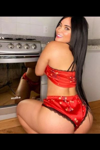 smiling Midlothian escort in red satin undies