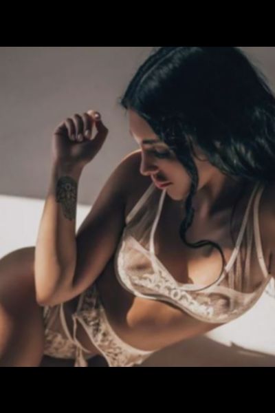 dark haired Stirling companion in lace underwear
