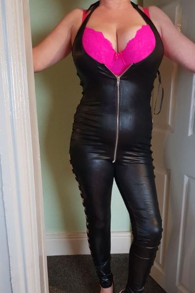 full figured Flintshire escort in leather overalls
