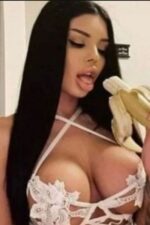 busty South Ayrshire escort eating a banana
