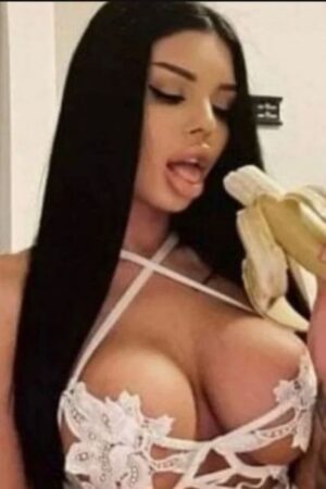 busty South Ayrshire escort eating a banana