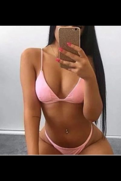 Brighton escort wearing pink bikini
