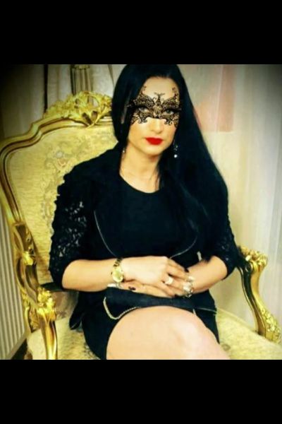 masked companion in fancy chair