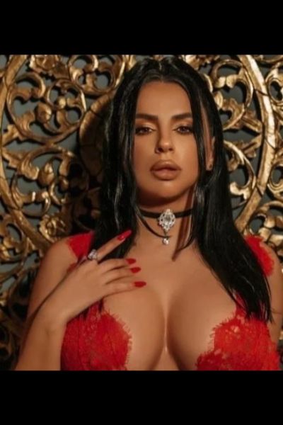 fit busty Chester escort showing cleavage