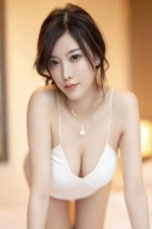 Asian Colchester escort wearing a gold necklace