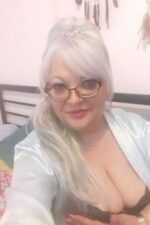 busty mature Bradford escort in white satin