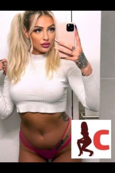 attractive blonde Waterford escort taking a selfie
