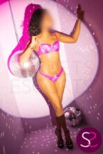 Black British escort in purple lingerie