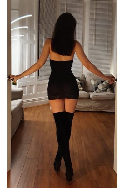 Natalia European Cardiff Escort showing her small bum