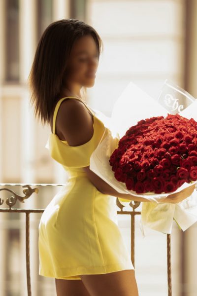 Ebony Manchester Escort holding roses