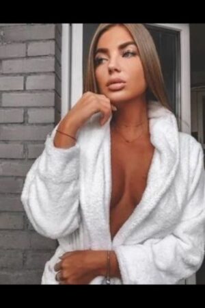 Brunette Aberdeen Escort in a white robe