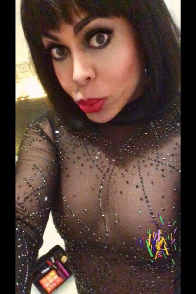 Salma TS in a black sheer top