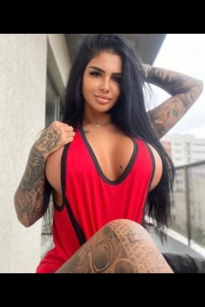 Busty Escort in Bangor in a red vest