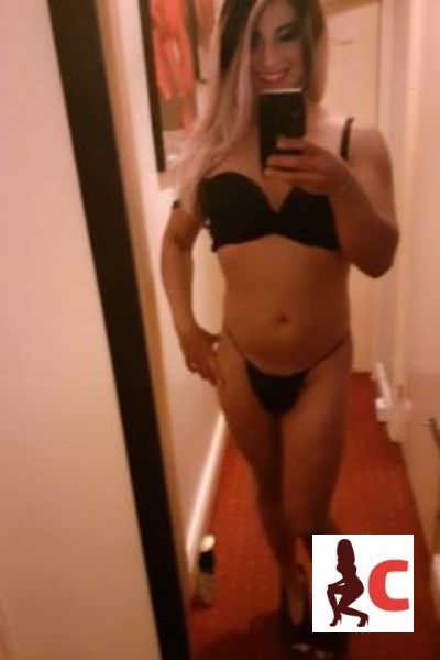 TS Sabryna XL takes a selfie in black lingerie