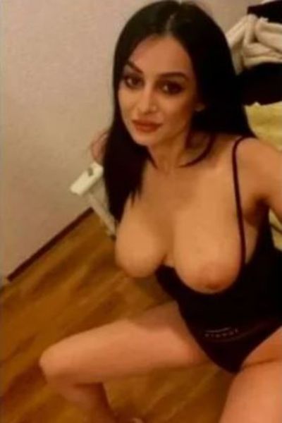 Bolton Party Girl in Town with her breasts hanging out of her top