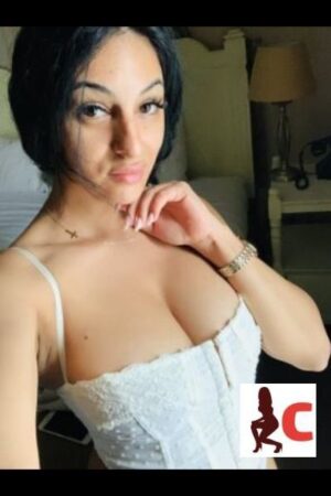 Elisabeta Brunette Meath Escort in a white corset