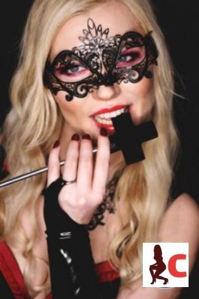 Alexandra Wildfire biting a velvet cross