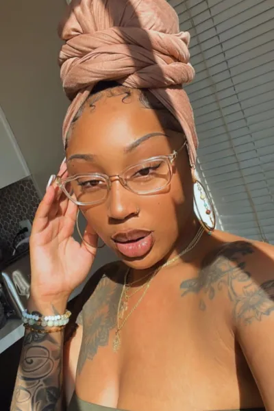 Ebony escort in see through glasses