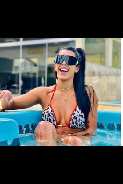 Julia Latina Escort in the pool in a bikini