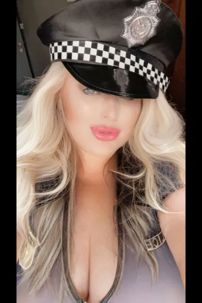Toni Evans in a police woman outfit