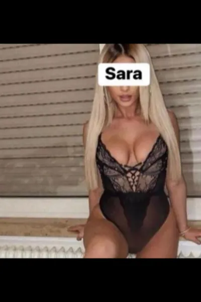 Blonde Kilmarnock Escort wearing a black sexy bodice