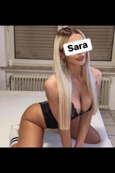 Blonde Kilmarnock Escort knelt on her bed