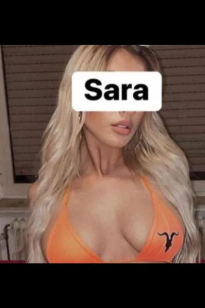 Blonde Kilmarnock Escort wearing a orange bra