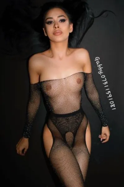 Party Girl in Perth laid on the floor in sheer black outfit