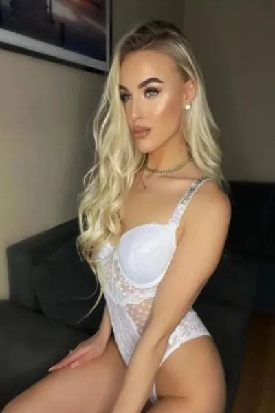 Sexy Blonde Winchester Escort in a white bodice