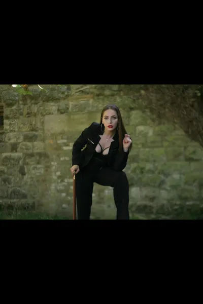 Mistress Annabelle holding a cane