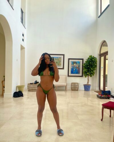 Ebony Cork escort in a green bikini