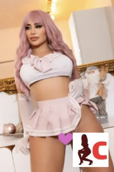 Pink haired escort wearing a very short skirt