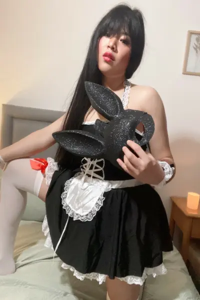 Thai TS escort holding a shiny rabbit mask