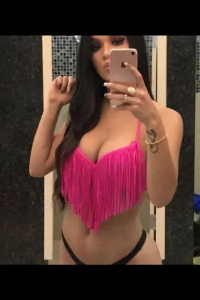 Dublin 1 Escort taking a selfie wearing frilly pink bikini