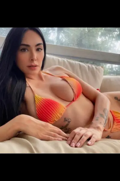 Sexy young Dublin escort in a red and orange bikini