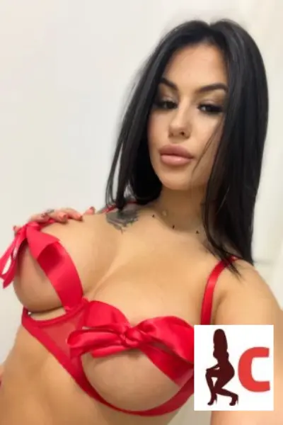 Dublin 24 Escort wearing a red bow bra