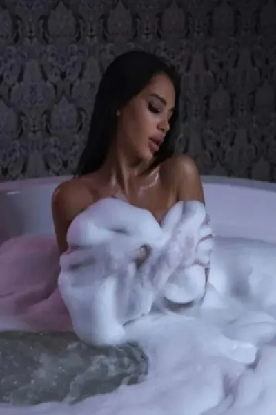 Young petite Motherwell escort getting foamy in the hot tub