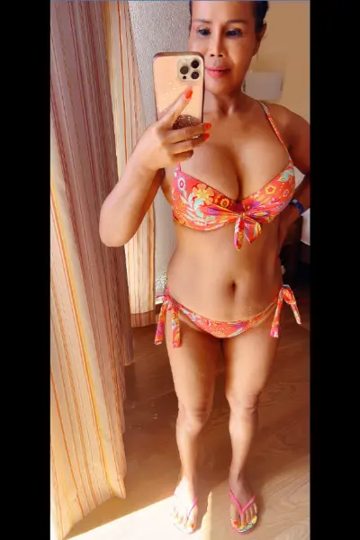 Oriental Mala Escort wearing a bikini