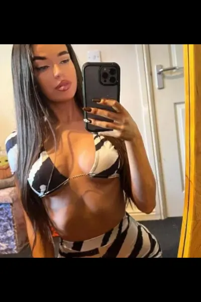 Young petite Gatwick escort taking a selfie