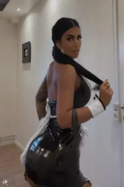 Hot brunette escort in PVC dress
