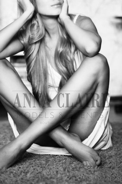 Blonde escort sat on the floor