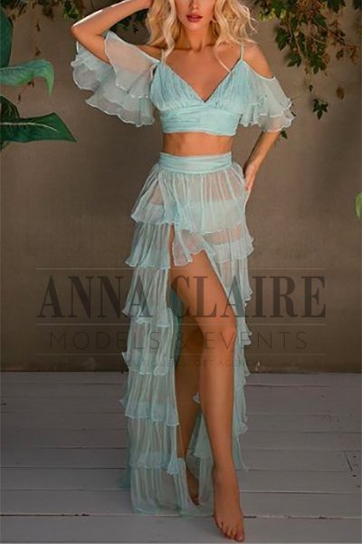 Hot blonde escort in teal summer dress