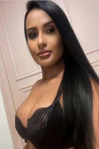 Sexy olive skinned escort in a black bra