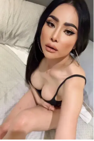 Pouting Asian escort