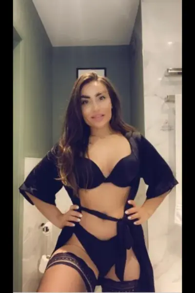 Brunette escort in black lingerie
