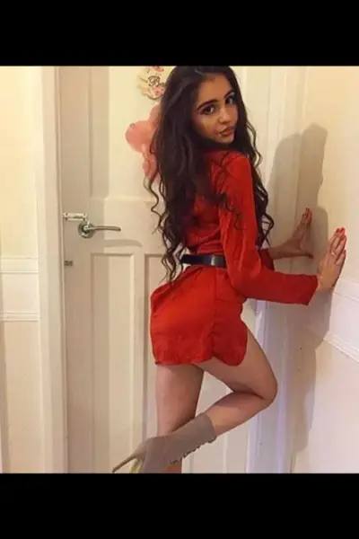 Young Teesside escort in a red outfit